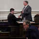 New Hampshire Speaker of the House Shawn Jasper hands the gavel to Rep. Frank Sapareto.